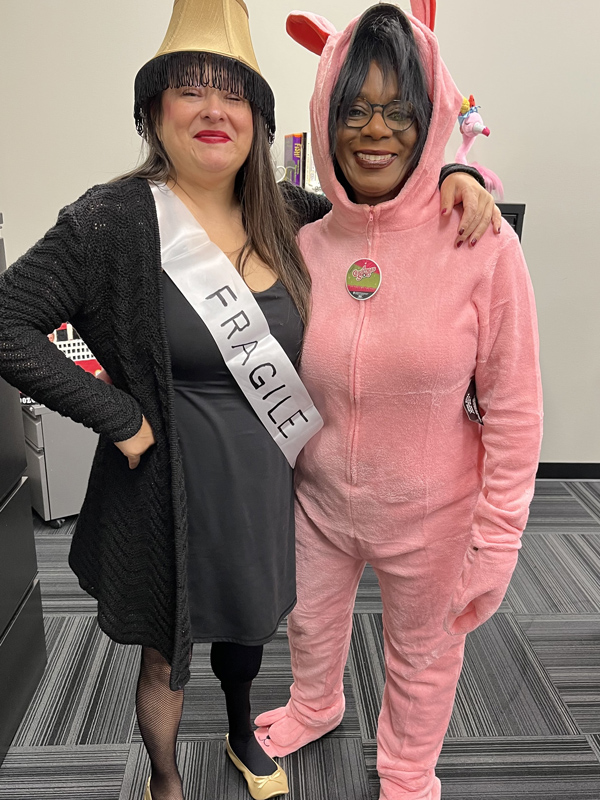 Employee dressed up as characters from A Christmas Story for Halloween