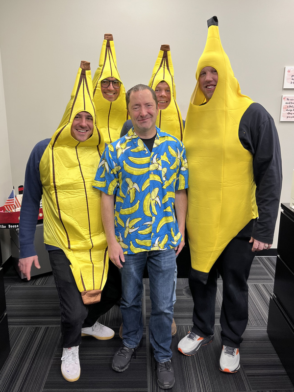 Employees dressed up as a bunch of bananas for Halloween